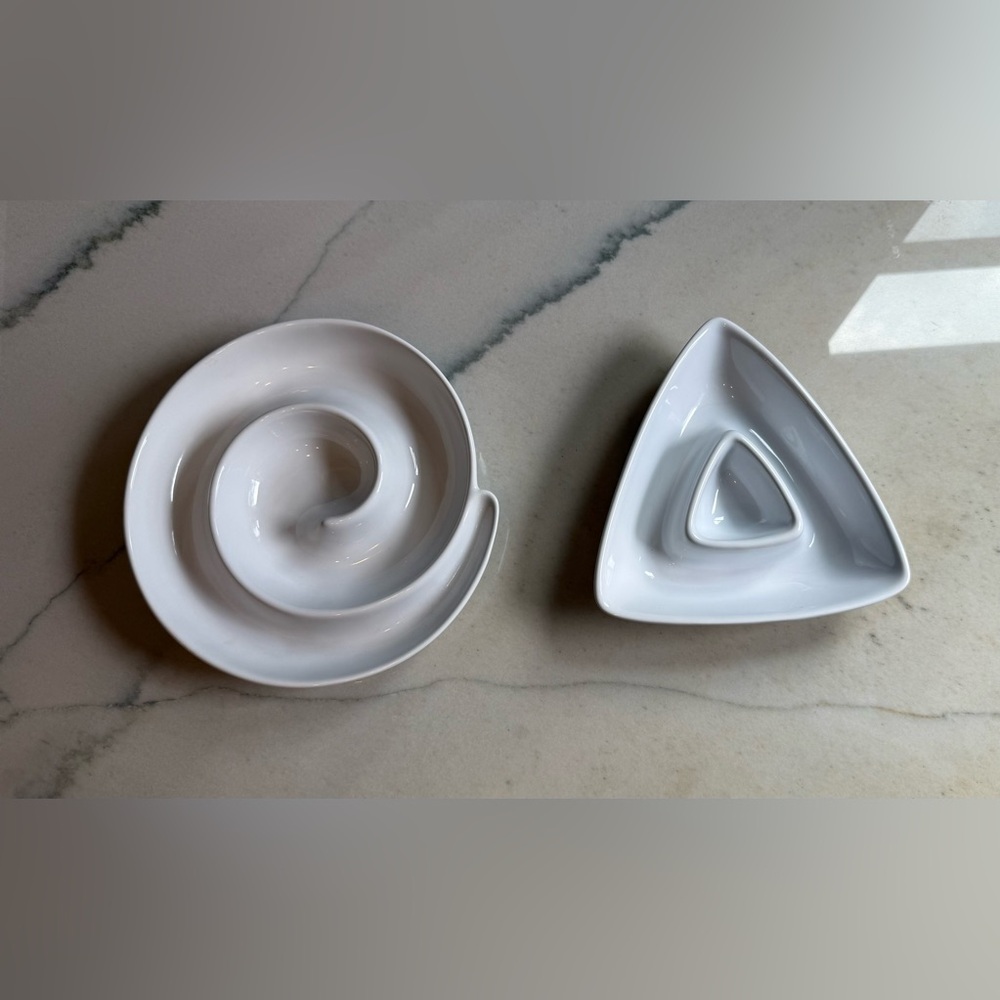Two white appetizer serving dishes
